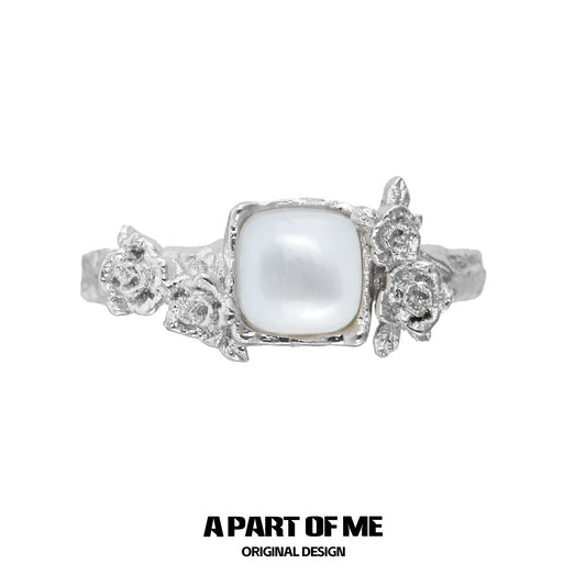 A Part of Me rose silver ring featuring a square pearl and detailed flower accents