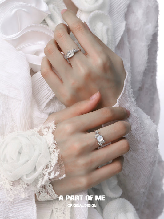 Elegant rose silver ring showcased on a model's hand with intricate designs and sparkling details