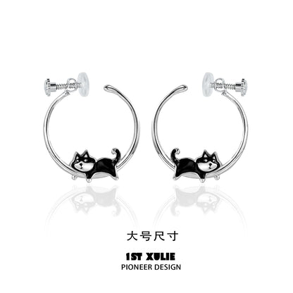 Cute running puppy earrings in silver featuring a playful dog design for animal lovers