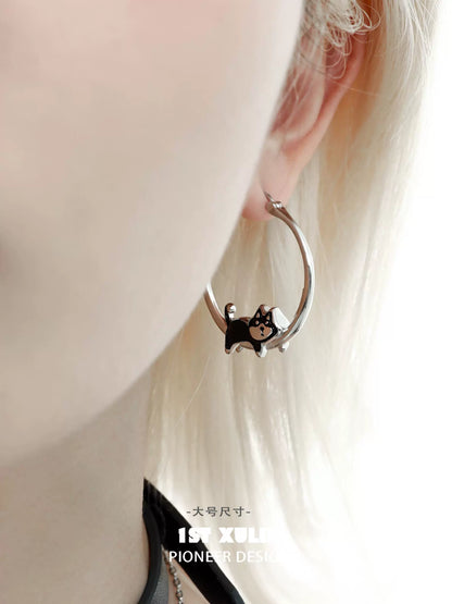 Cute running puppy earrings in silver hoop style for pet lovers and trendy accessories