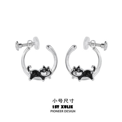 Sleek silver running puppy earrings featuring a playful design of a puppy in motion