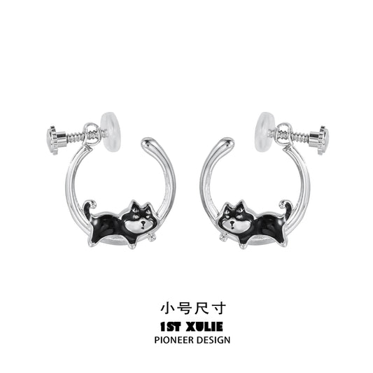 Sleek silver running puppy earrings featuring a playful design of a puppy in motion