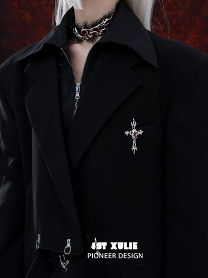 Sacred cross silver brooch on a black jacket for a bold, stylish accessory look