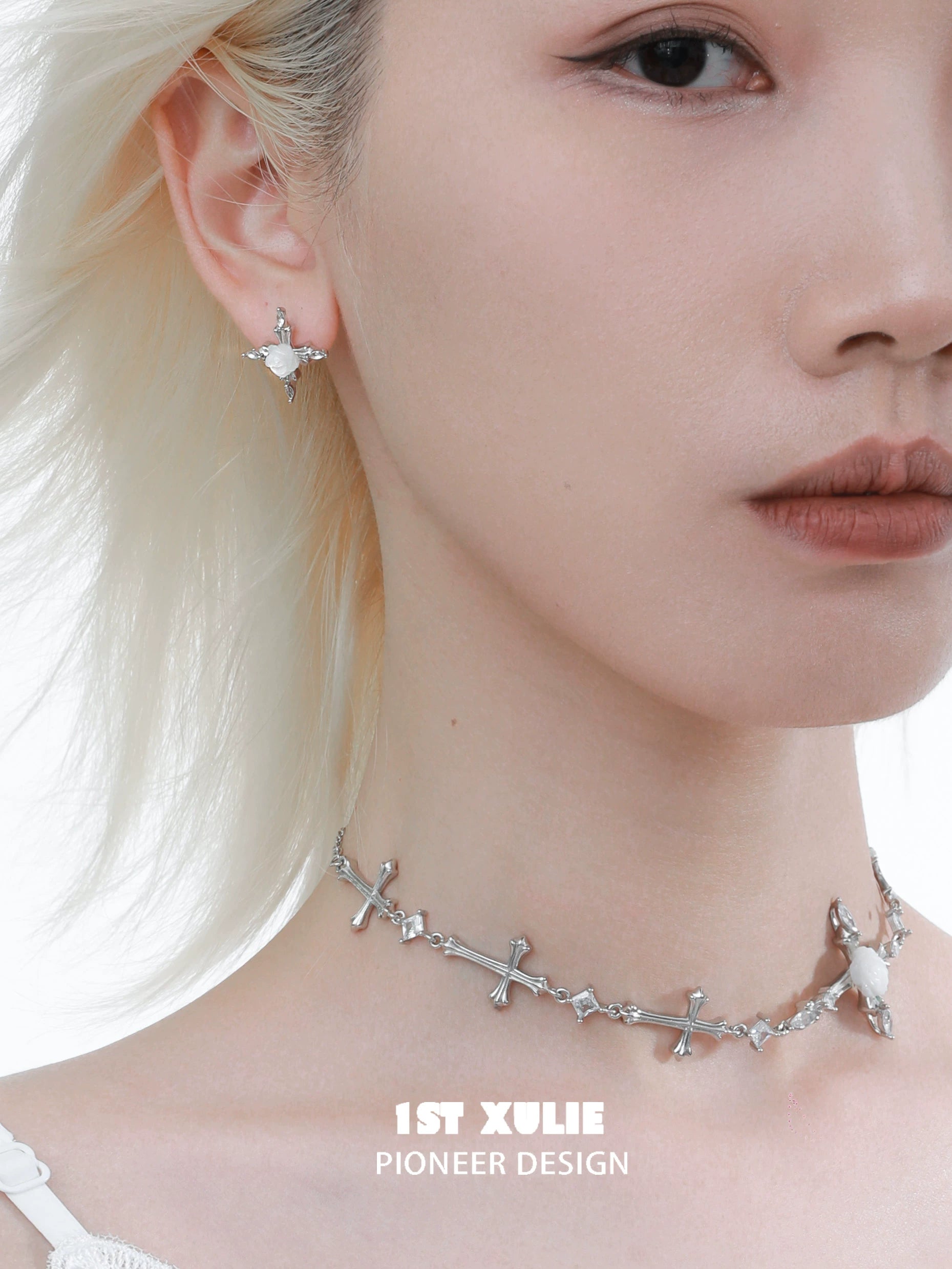 Sacred rose cross earrings in silver, designed by 1STXULIE, worn with matching choker for a chic look