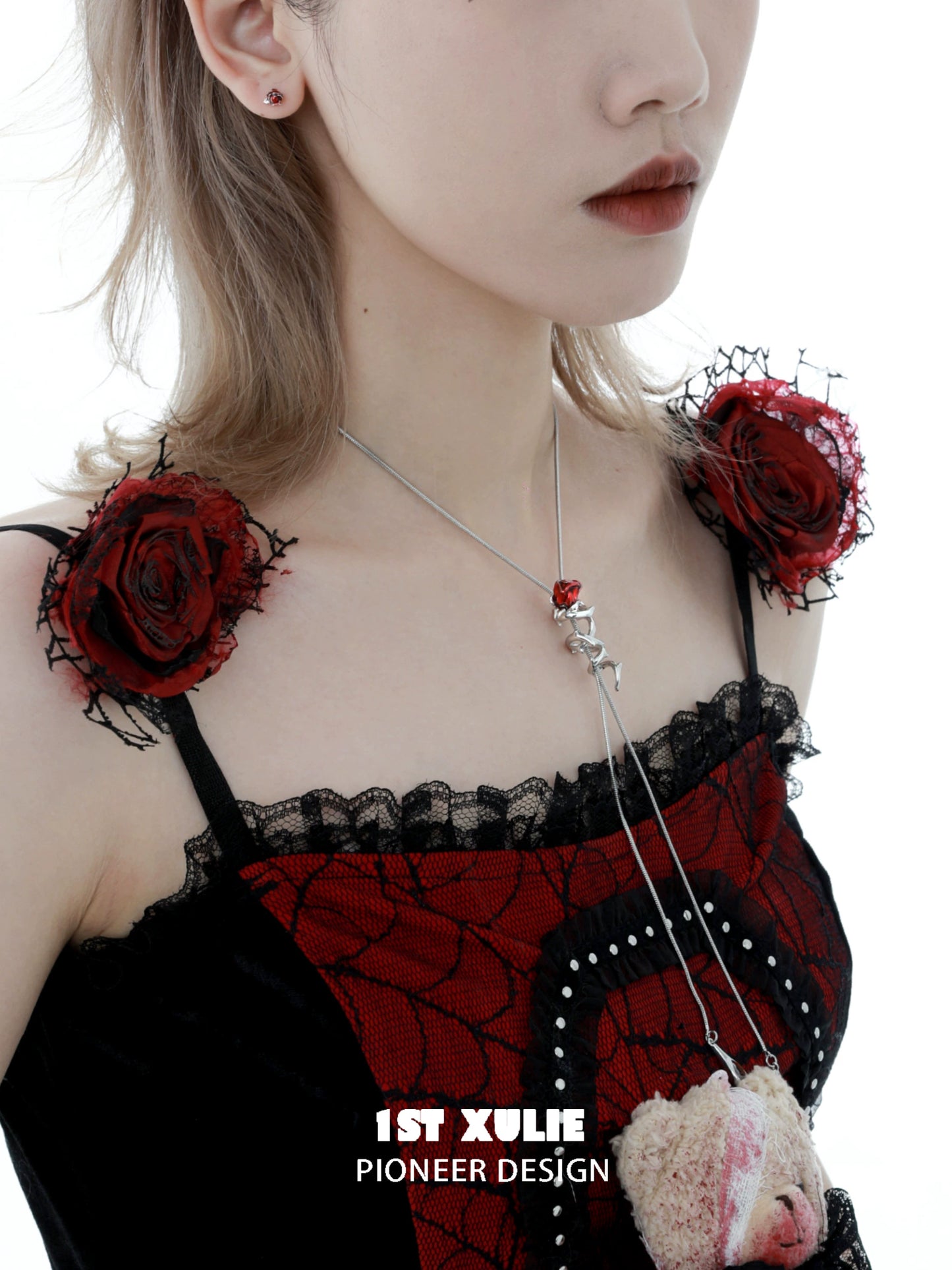 Scarlet rose clavicle chain necklace with a unique design, worn by a model in a stylish outfit