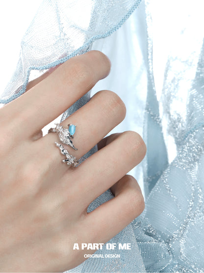 A Part of Me Sea Conch Ring featuring a delicate design with blue gemstone detail