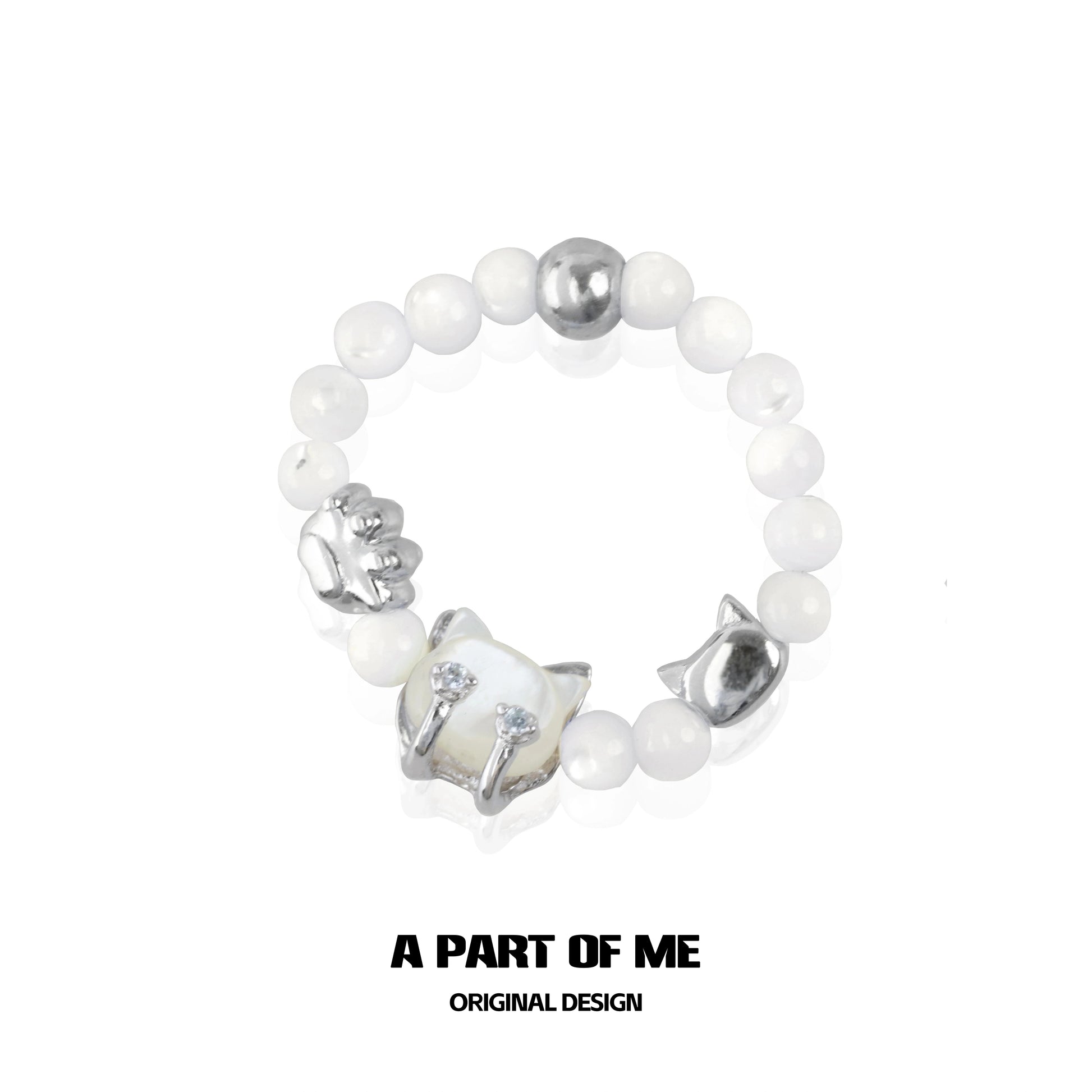 Shell cat beaded ring from A PART OF ME featuring intricate cat charm and white beads