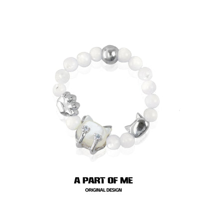 Shell cat beaded ring from A PART OF ME featuring intricate cat charm and white beads