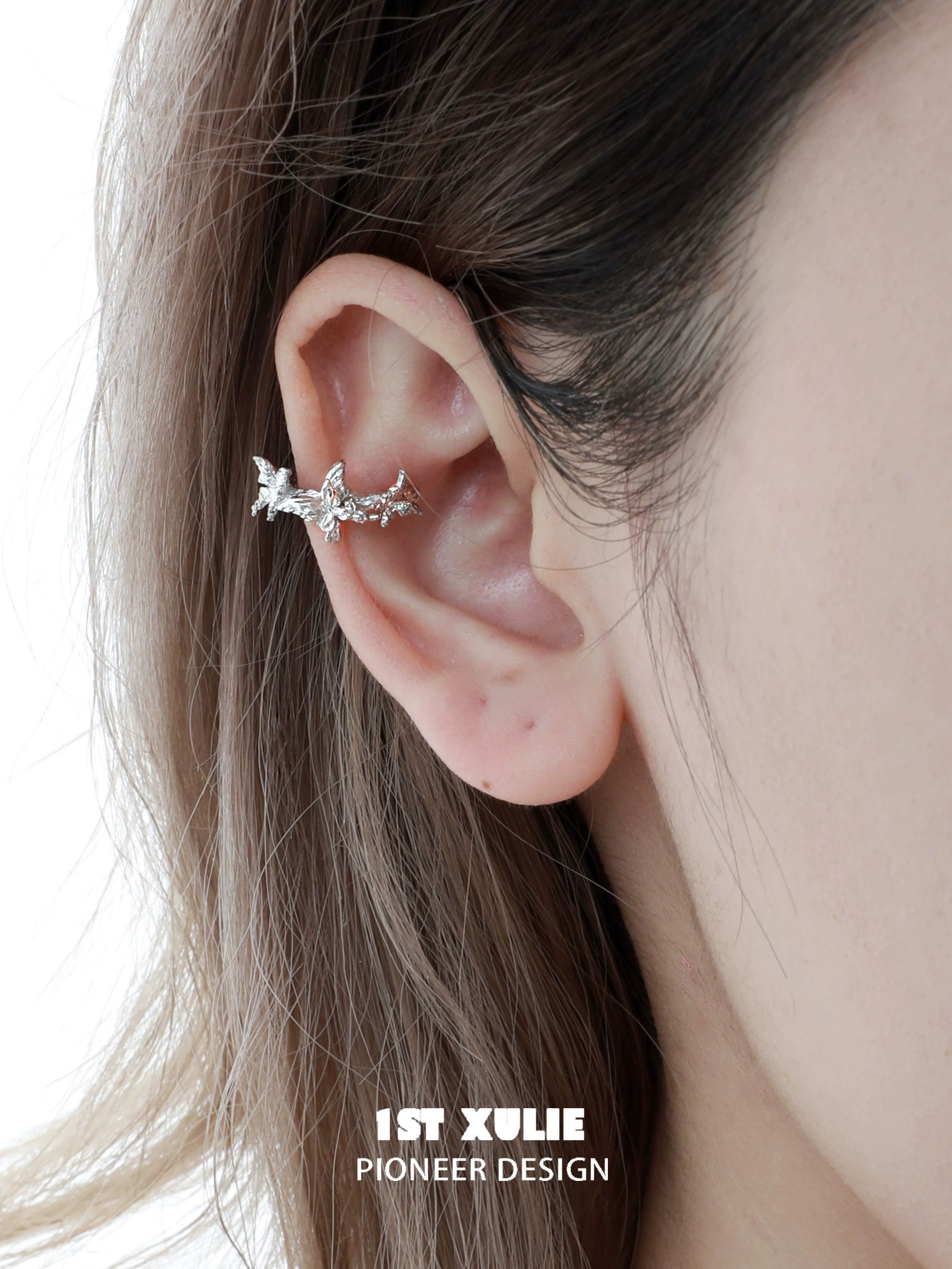 Silver butterfly ear cuff by 1STXULIE, featuring a delicate design that wraps around the ear