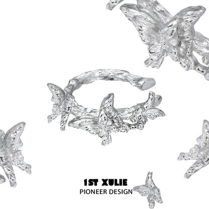 Elegant silver butterfly ear cuff featuring intricate butterfly and floral designs by 1ST XULIE