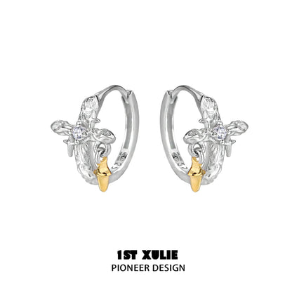 Silver Cross Ear Clips by 1STXULIE featuring a unique design with gold accents