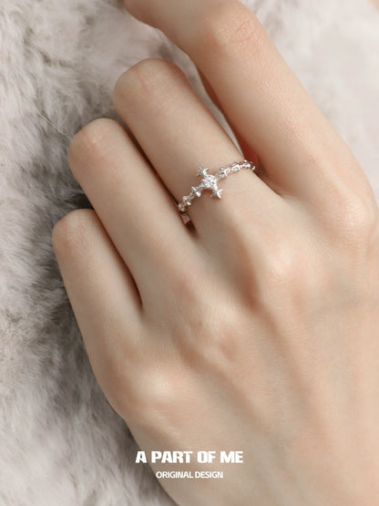 A Part of Me Silver Cross Ring on a hand, featuring intricate design suitable for various occasions