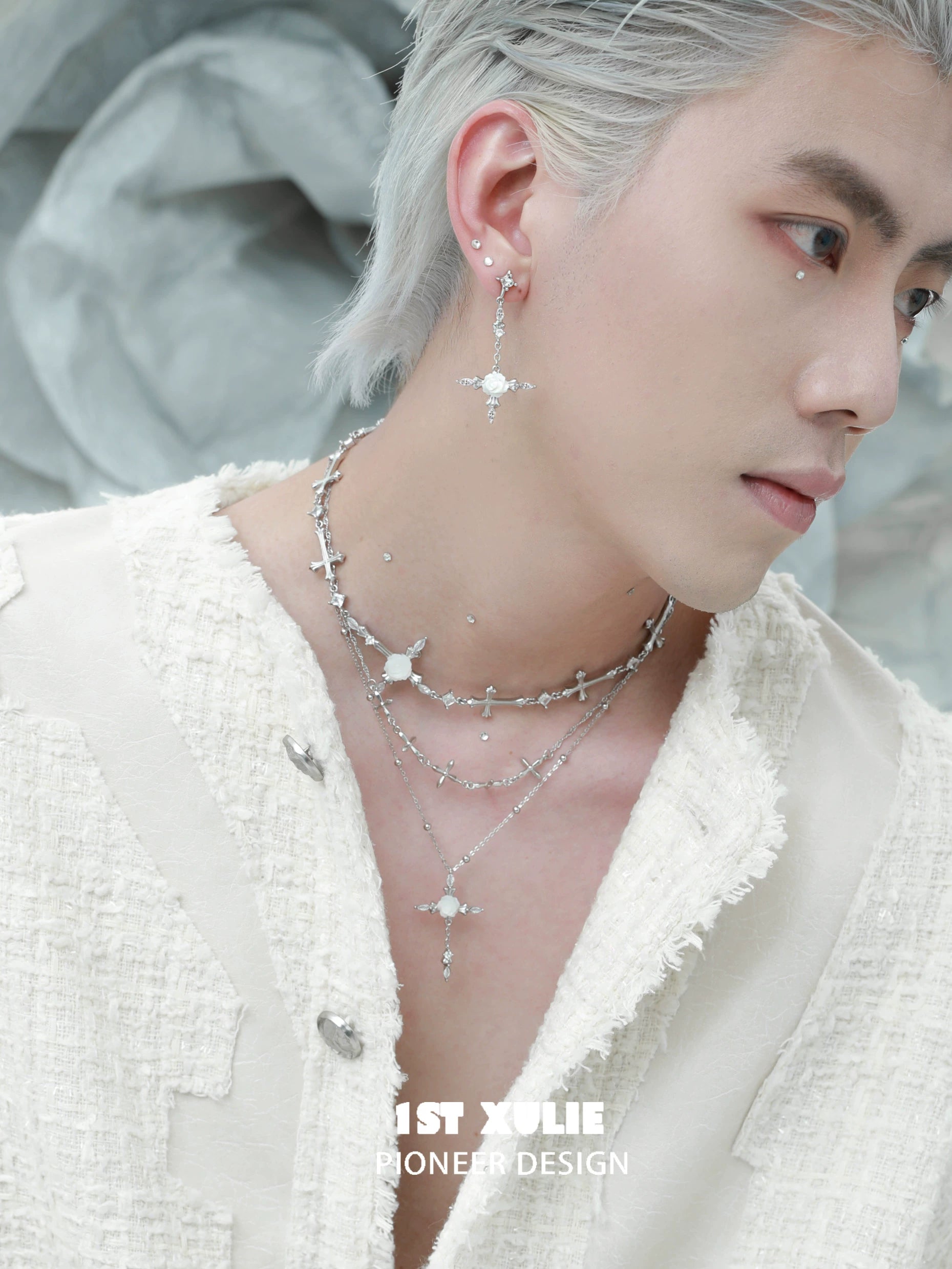 Stylish Model Wearing a Silver Rose Cross Necklace with Elegant Layered Design