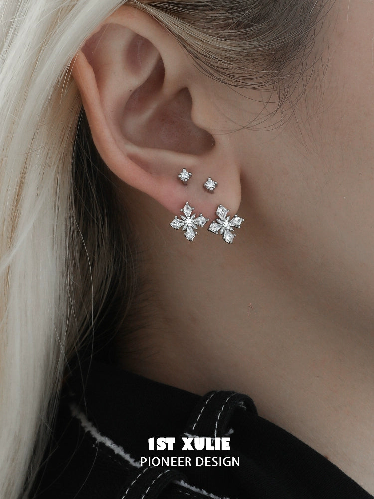 Elegant silver star earrings with crystal accents, perfect for adding sparkle to any outfit