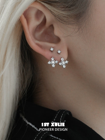 Elegant silver star earrings with crystal accents, perfect for adding sparkle to any outfit