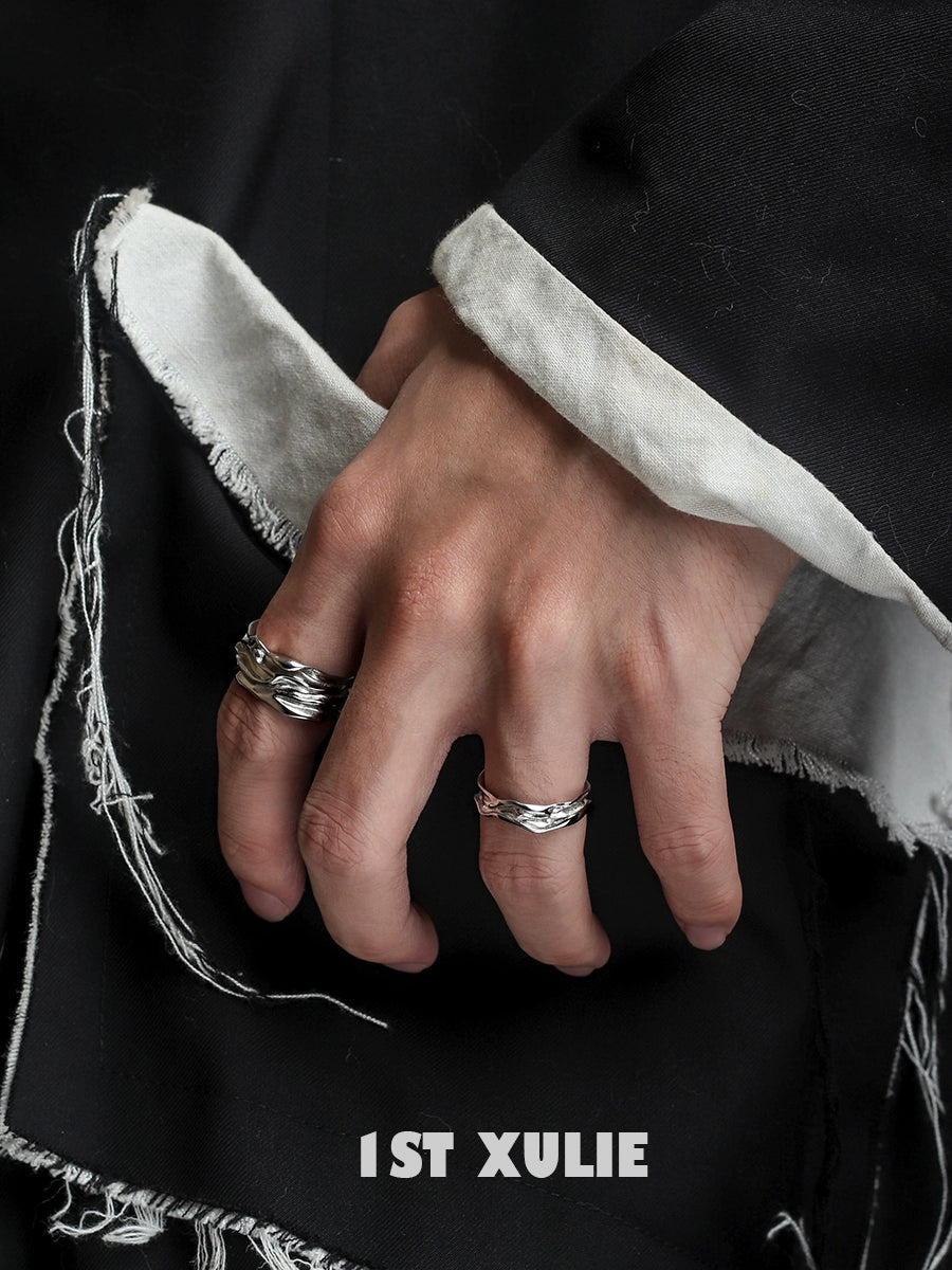 Stylish silver statement ring worn on hand with textured details and contemporary design by 1STXULIE