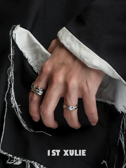 Stylish silver statement ring worn on hand with textured details and contemporary design by 1STXULIE
