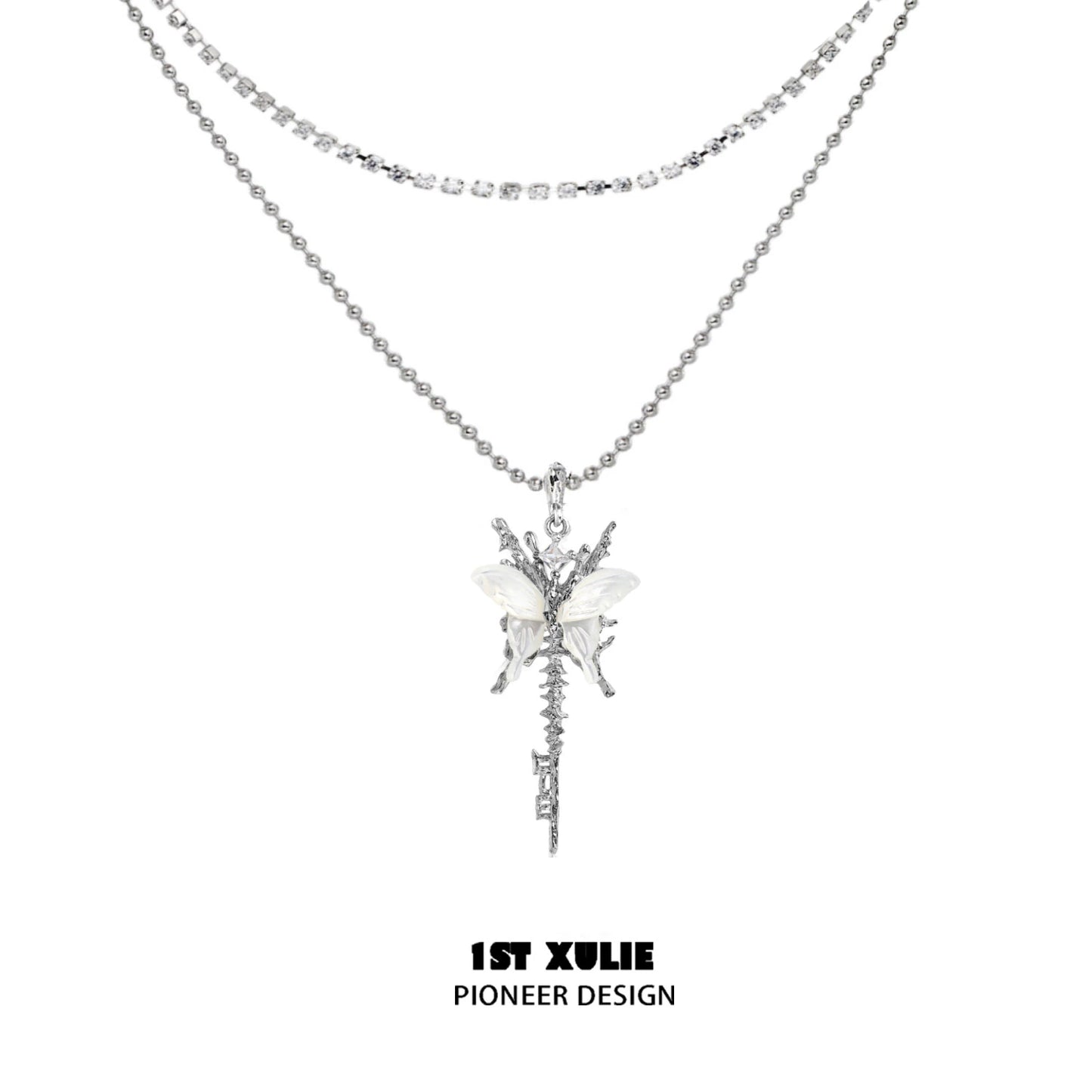 Skeleton butterfly pearl necklace by 1STXULIE featuring layered silver design with elegant embellishments