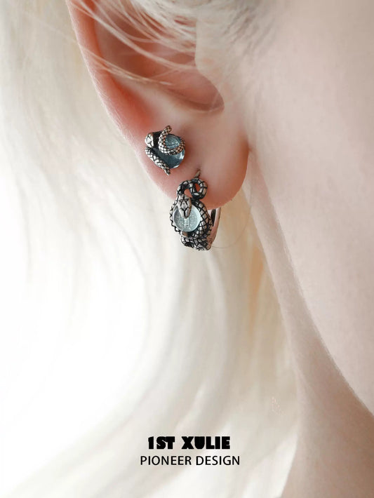 Slytherin fang earrings featuring intricate snake design and sparkling accents for a stylish look