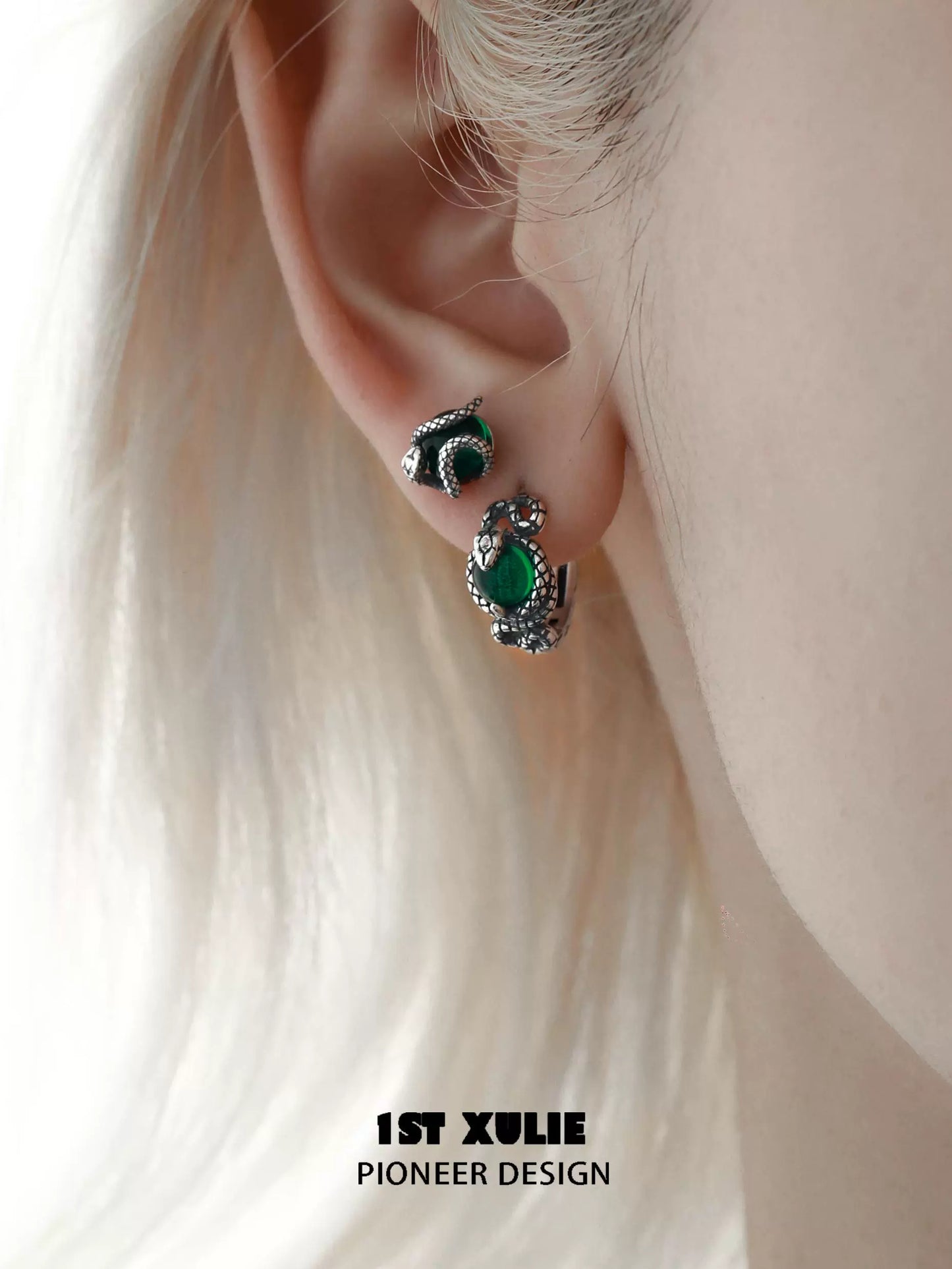 Slytherin fang earrings featuring green stones and intricate silver design for stylish fans