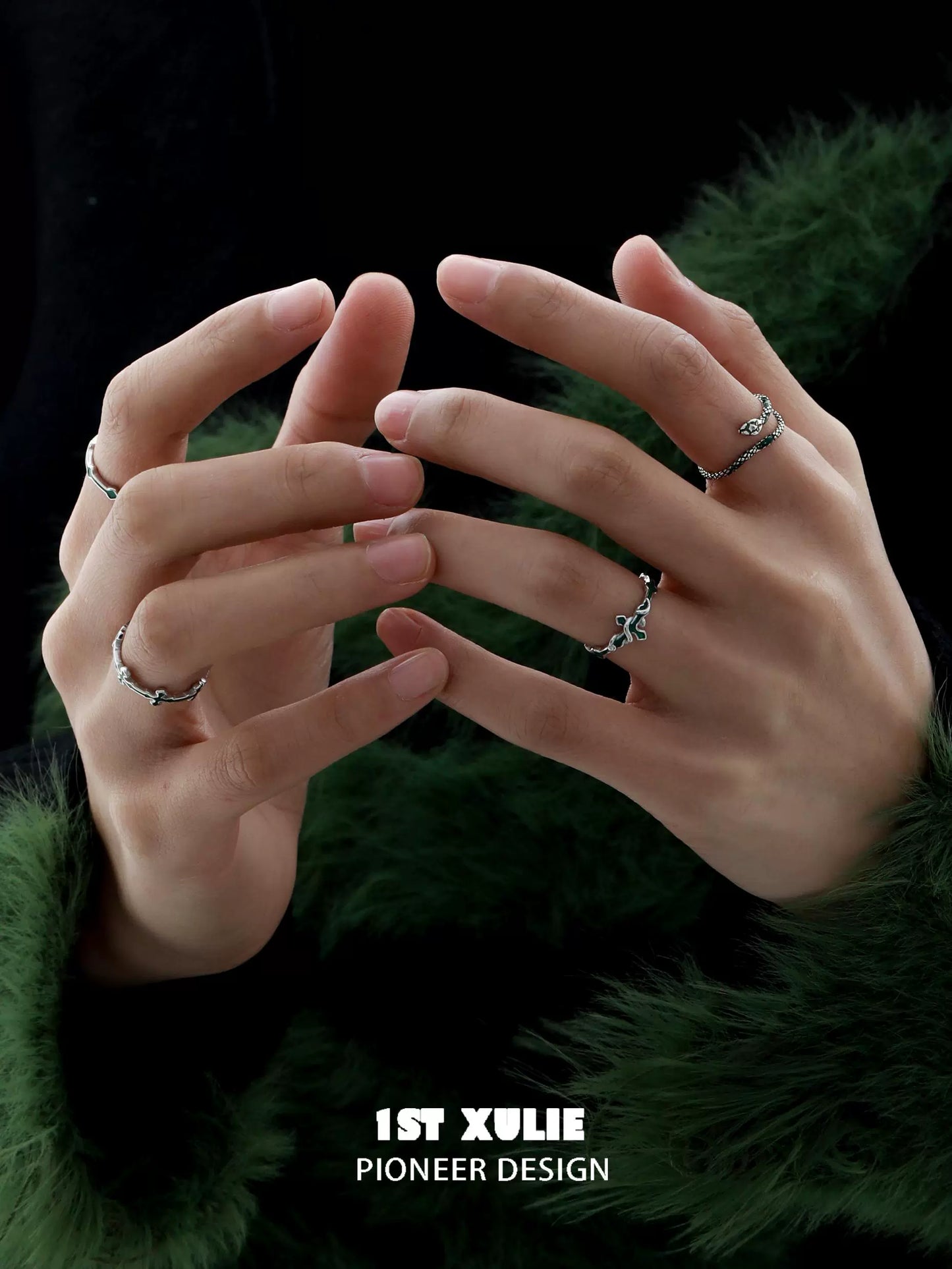 Two stylish Slytherin snake couple rings on fingers showcasing unique design and craftsmanship