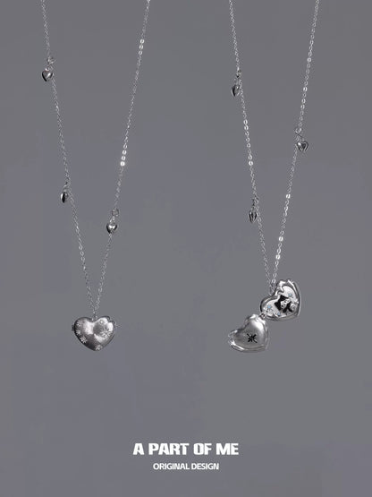A PART OF ME snow kitten love pendant necklace featuring intricate heart designs in silver