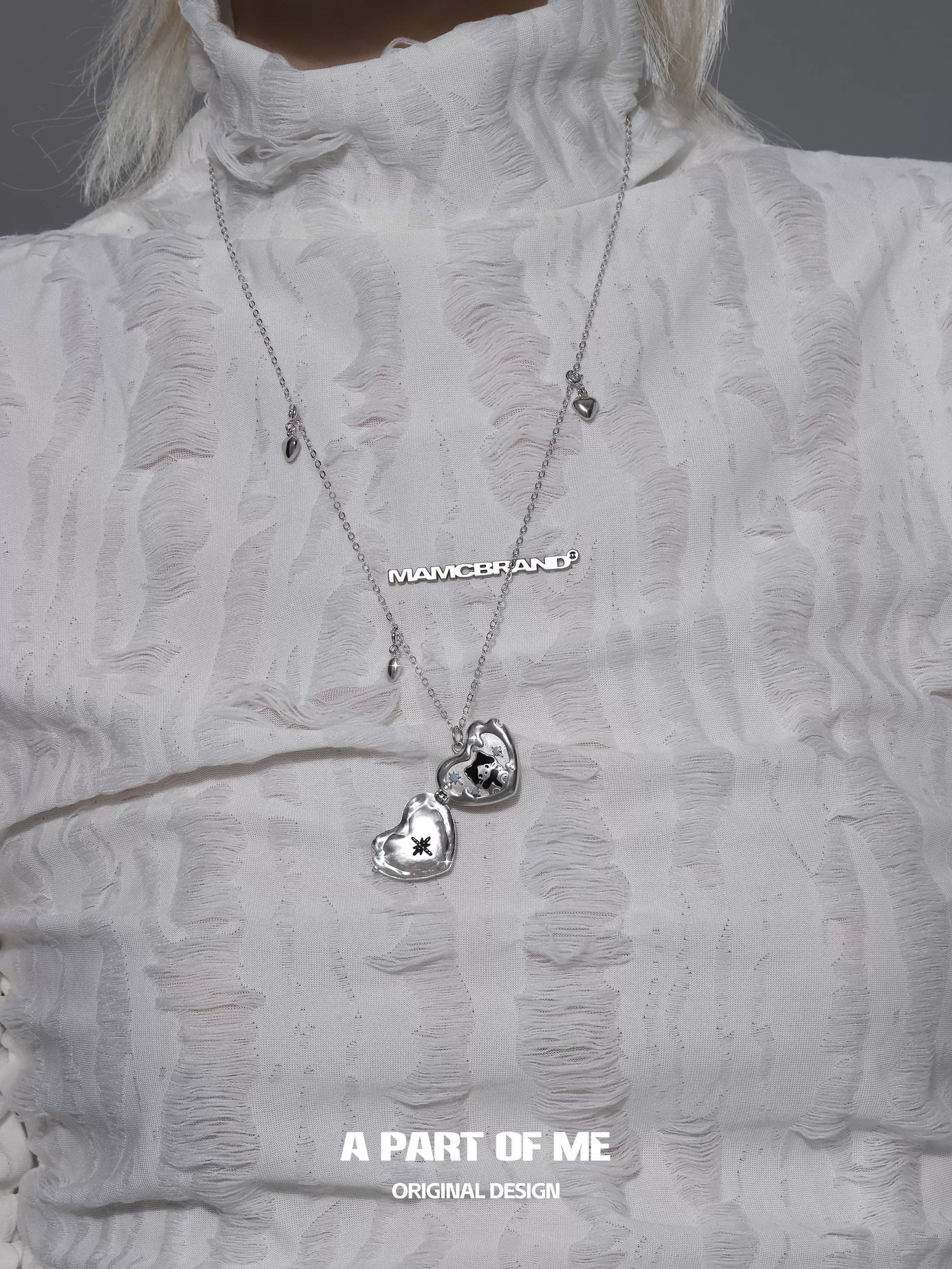 Silver snow kitten love pendant necklace featuring two heart charms for a stylish look