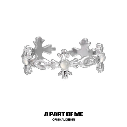 Silver snowflake cross agate ring featuring floral designs for a unique accessory