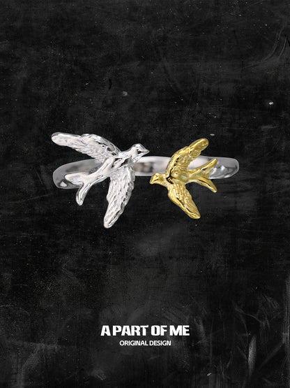 Soaring birds ring featuring a delicate silver and gold bird design, perfect for nature lovers