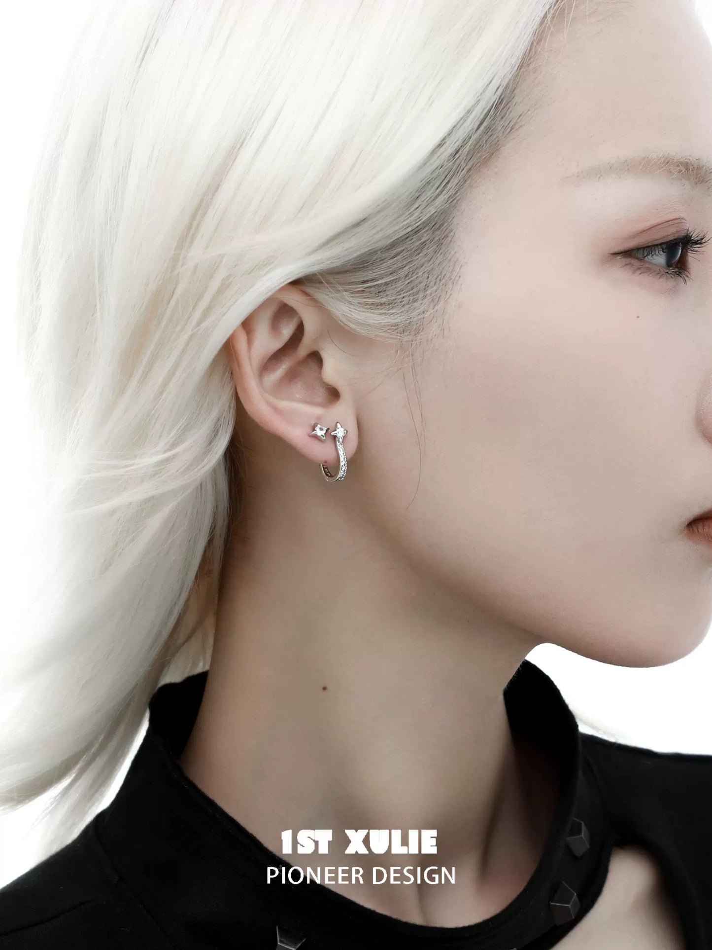Stylish star hoop silver earrings worn by a model with sleek hair for a modern look