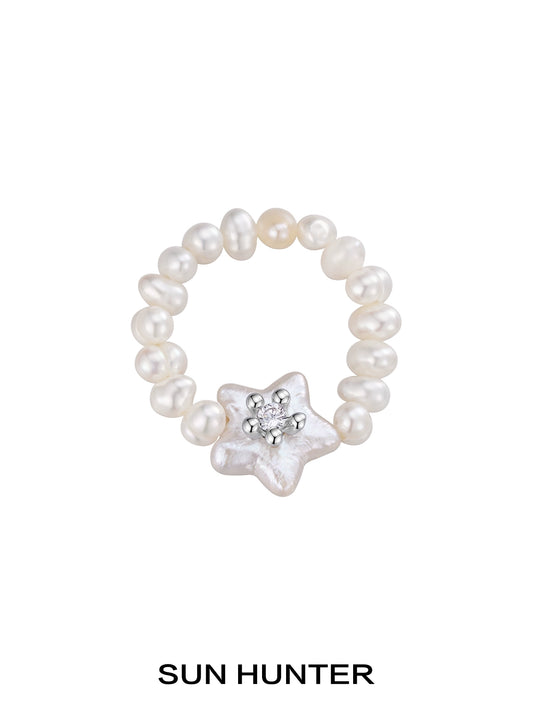 SUN HUNTER star pearl ring featuring shimmering star-shaped pearl with surrounding little pearls