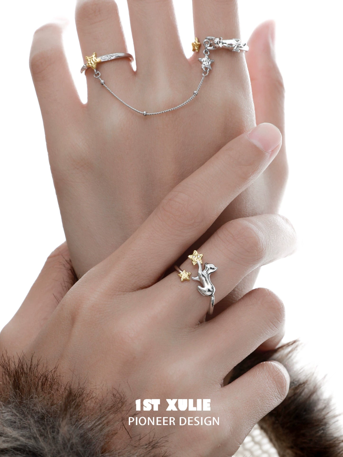 Star picking cat chain ring by 1STXULIE worn on hand showcasing unique design and charm