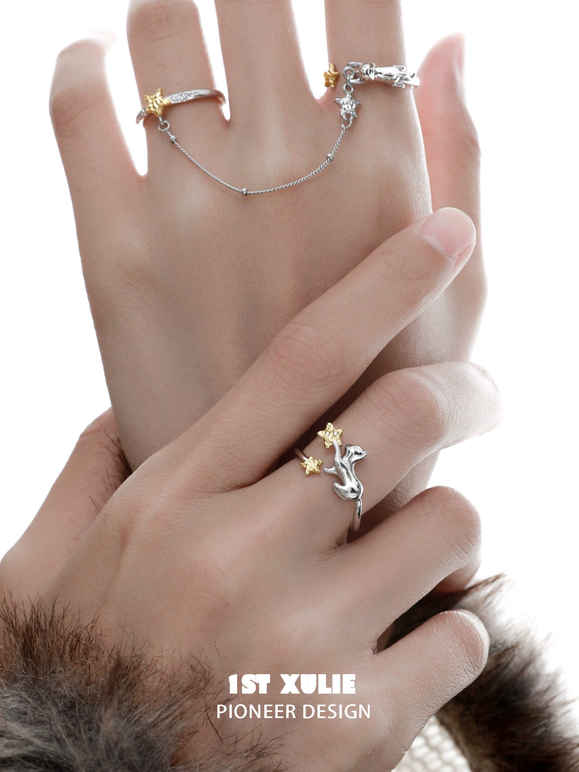 Star picking cat chain ring by 1STXULIE worn on hand showcasing unique design and charm