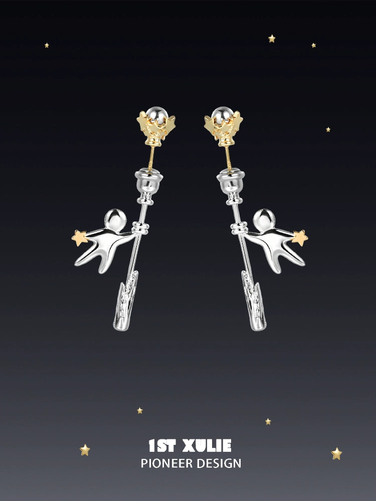 Unique 1ST XULIE star stud earrings featuring playful astronaut design and gold accents
