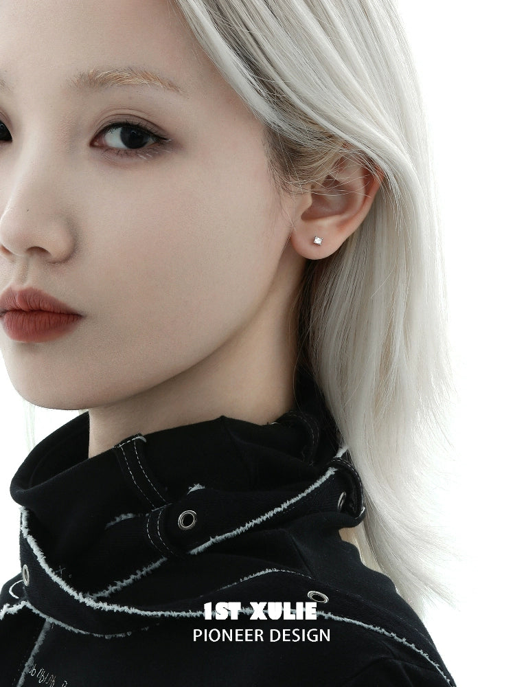 Elegant model wearing star zircon earrings with a minimalist design for a modern look