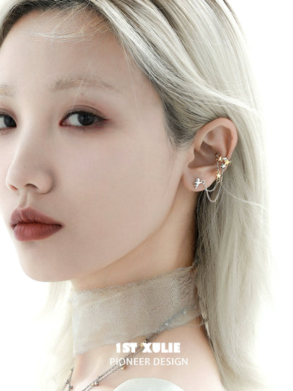 Stylish model wearing a 1STXULIE starlight ear cuff with a delicate design and elegant chain detail