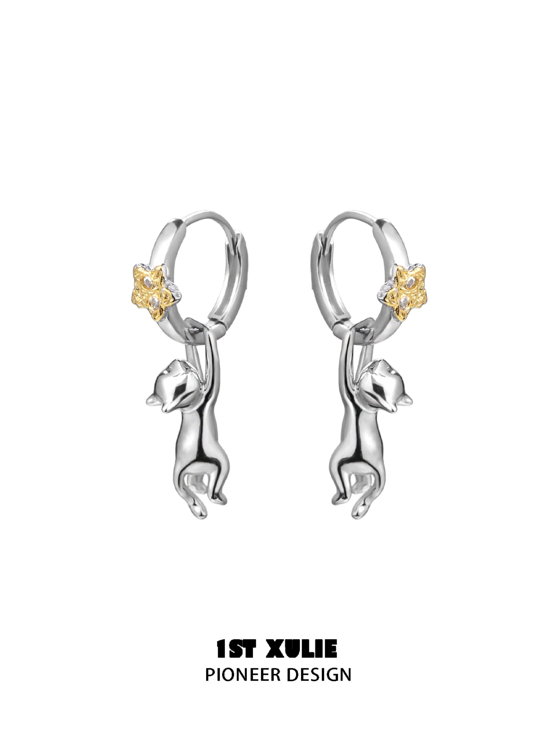 Starlit cat silver earrings with a playful cat design and yellow star accents
