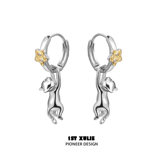Starlit cat silver earrings featuring a playful cat design and gold star accents from 1ST XULIE