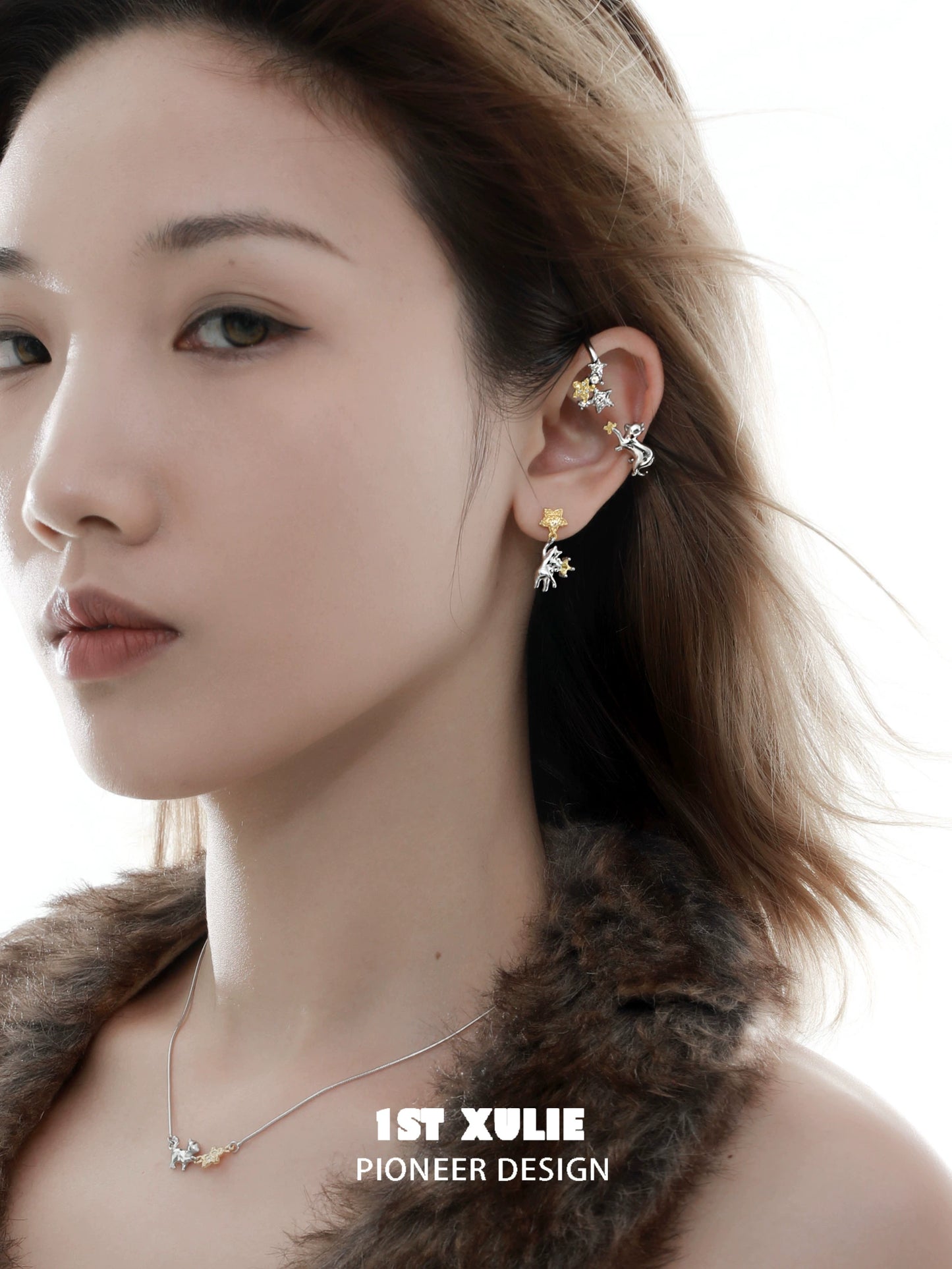 Model wearing a starry cat ear cuff with a delicate design, showcasing elegance and style