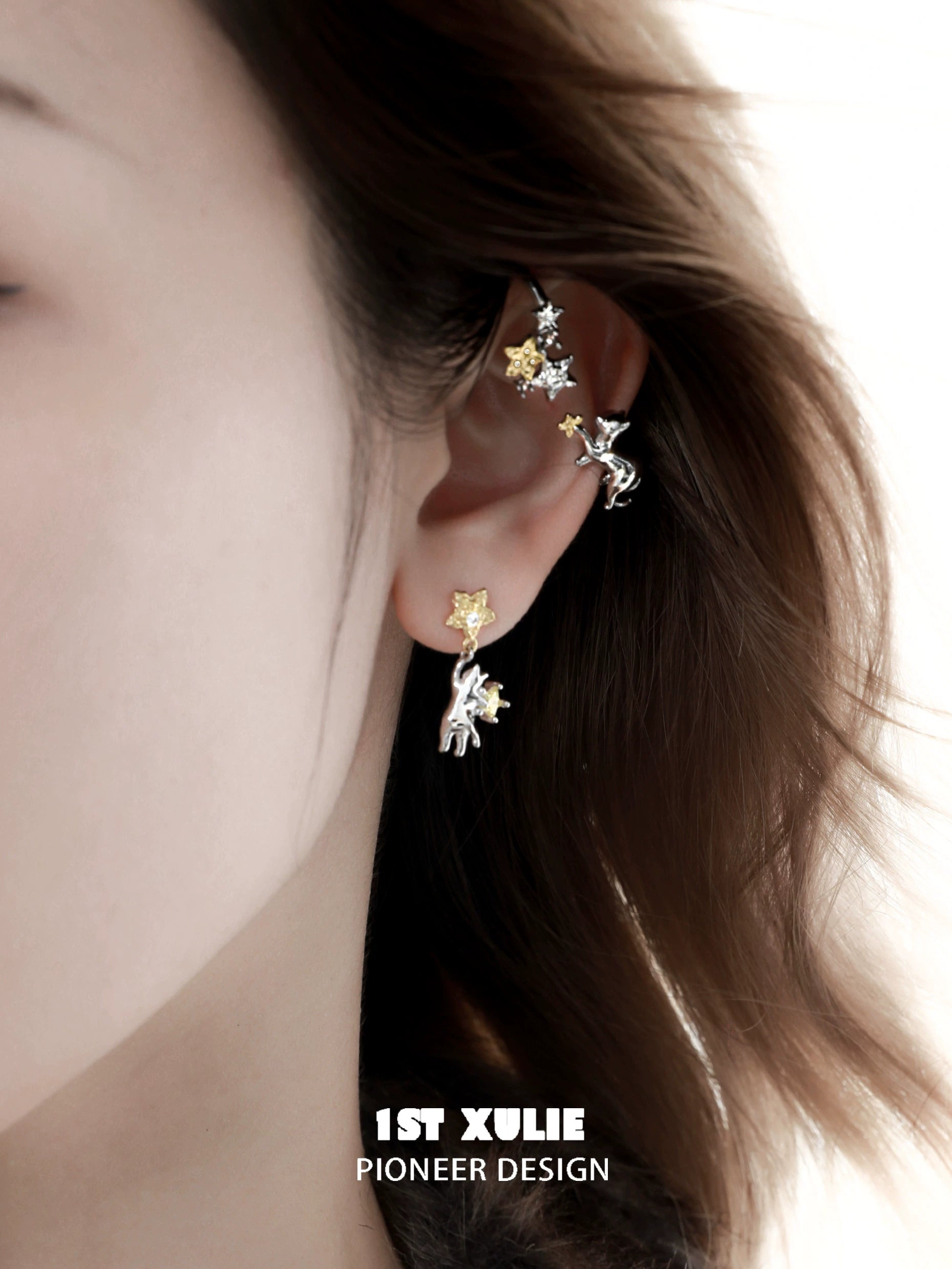 Starry cat ear cuff featuring silver and gold stars designed for unique fashion statements
