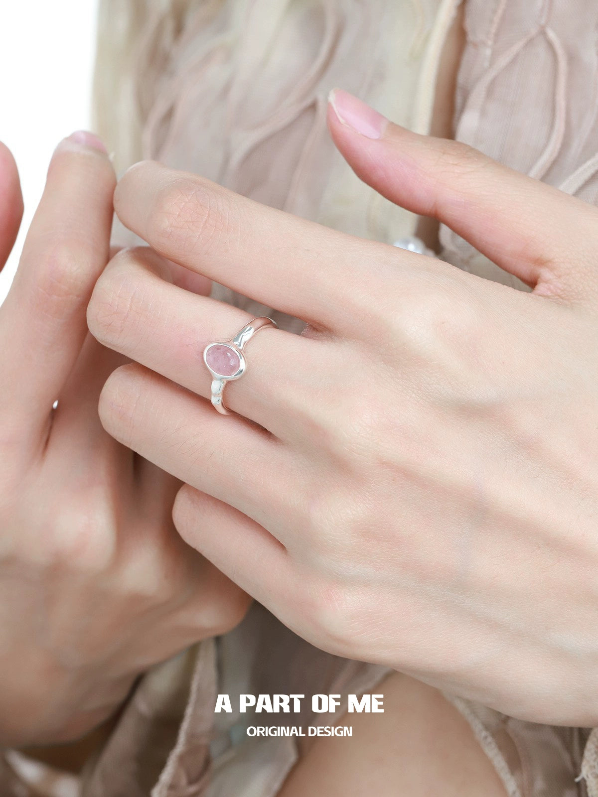 Strawberry stone silver ring displayed on a model's hand with a delicate design by A PART OF ME