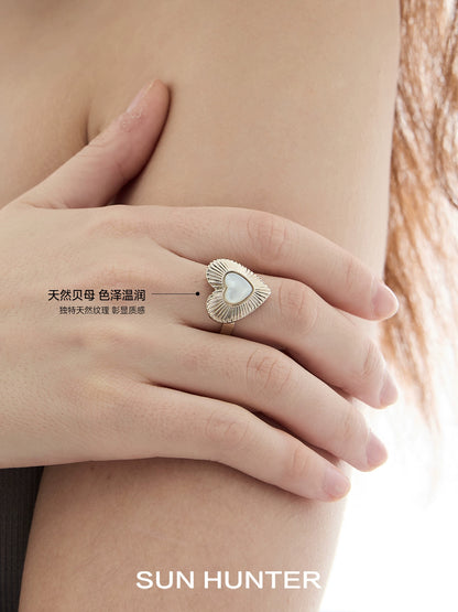 Elegant butterfly mother-of-pearl ring by SUN HUNTER on a model's hand for a chic look