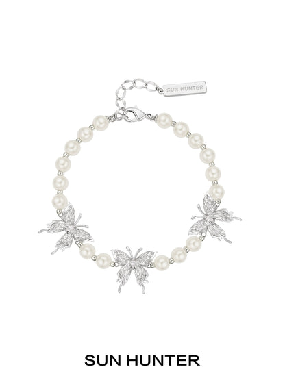SUN HUNTER butterfly pearl bracelet with silver butterfly charms and elegant pearl beads
