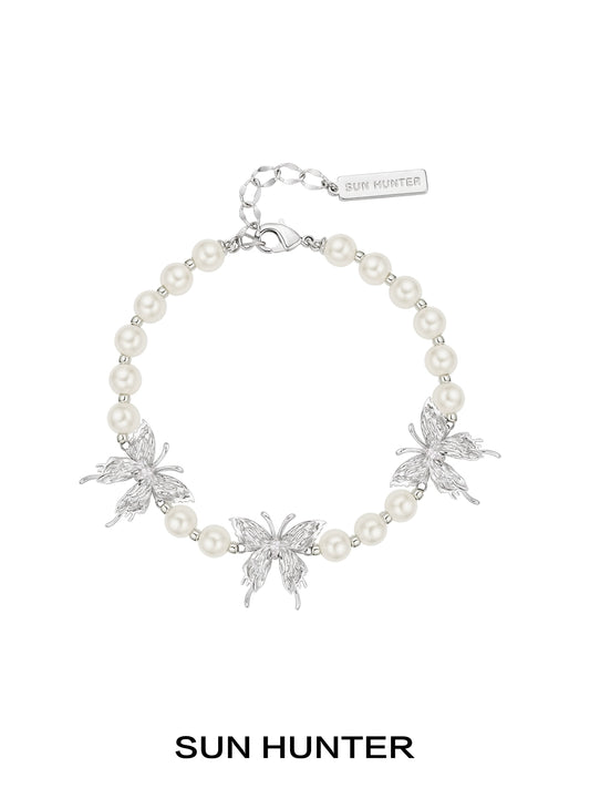 SUN HUNTER butterfly pearl bracelet with silver butterfly charms and elegant pearl beads
