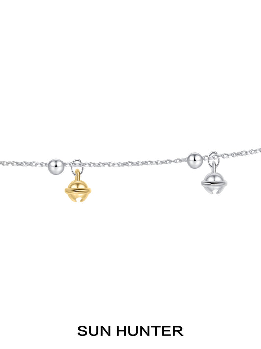 Sun Hunter jewelry golden bell pendant necklace for women featuring gold and silver bells on a delicate chain