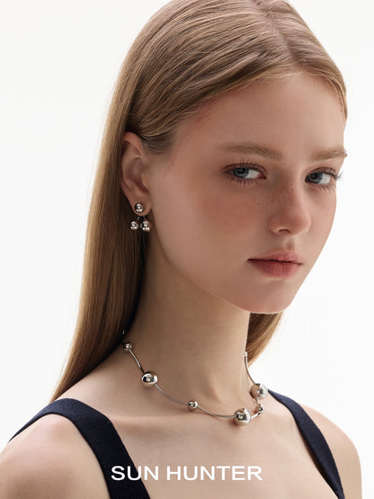 Elegant sun hunter jewelry planet silver necklace for women worn with matching earrings