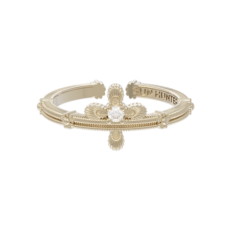 Elegant SUN HUNTER lace cross ring featuring intricate detailing and a sparkling center stone