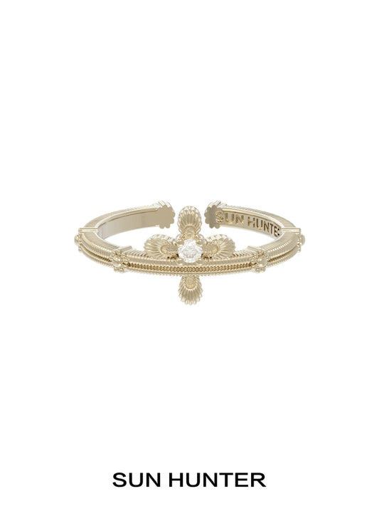Elegant SUN HUNTER lace cross ring in gold with intricate detailing for a timeless accessory