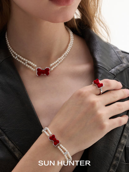 SUN HUNTER Velvet butterfly heart ring paired with pearl bracelet and necklace for elegant style