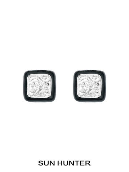 Elegant vintage coin stud earrings by SUN HUNTER with intricate silver designs and a classic look